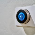 HVAC thermostat set to 63 degrees