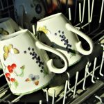 mugs with flowers in dishwasher